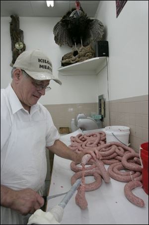 Kilgus Meats owner Erich Schiehlen makes many of the sausages sold at the Laskey Road butcher shop.