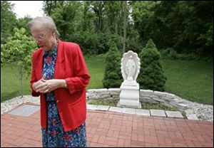 Barbara Davis, a Sister of Charity, reflects on her 43-year career in elementary education in the garden at Sylvania Franciscan Academy. Besides teaching and serving as principal at several Catholic schools, Sister Barbara has also worked as a consultant in education for the Catholic diocese.