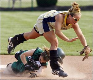 Whitmer shortstop Melissa Gorsuch, being toppled on a steal, is the top City League player.
<br>
<img src=http://www.toledoblade.com/assets/gif/TO17150419.GIF> VIEW: <a href=