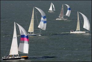 The Sagitta, foreground, captained by Jon Somes, competes in the Mills Trophy Race.
