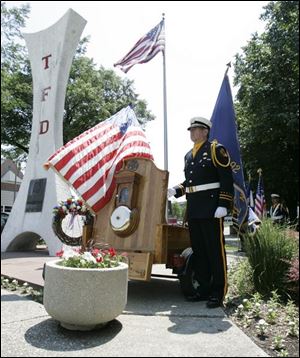 To the somber sound of a fire bell rung by Lt. Richard Knight, Toledo honors its fallen firefighters in a tradition-filled ceremony at the fire department memorial downtown. 