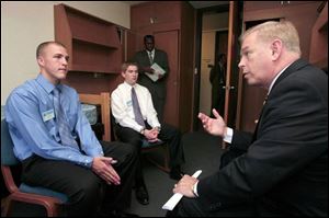 Gov. Ted Strickland, right, meets with Buckeye Boys State's top elected officials, Gov. James Evans, left, and Lt. Gov. John Jones, at Bowling Green State University. 'These guys are the cream of the crop,' Mr. Strickland said of the 1,189 soon-to-be high school seniors taking part in the hands-on government program.