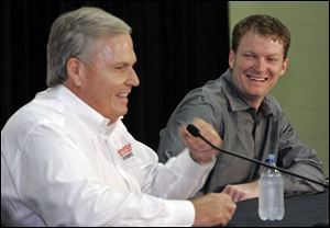 Rick Hendrick, left, owner of Hendrick Motorsports, shares a laugh with Dale Earnhardt Jr. during a news conference yesterday, when it was announced Earnhardt will join Hendrick.