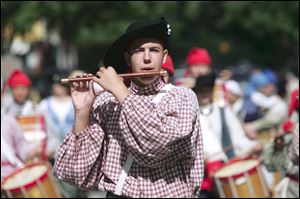 Mark Roberts, 16, leads the Voyageur Ancient Fife and Drum Corps of Lafayette, Ind., in the River Raisin celebration.