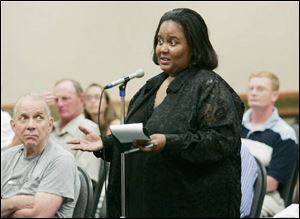 Amber Hawkins asks about access for the disabled and offers some suggestions for the proposed downtown arena project during a public forum at SeaGate Centre.