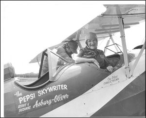 Blade staff reporter Millie Benson sits in the cockpit of ''The Pepsi Skywriter'' in this May 23, 1987 at Toledo Express Airport. 