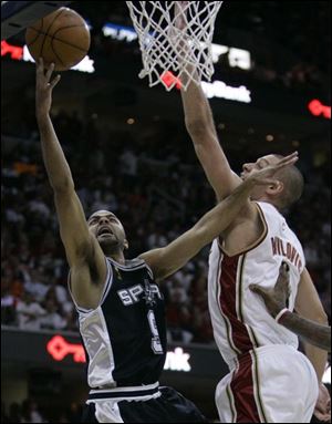 Spurs guard Tony Parker shoots over the Cavaliers' Sasha Pavlovic in Game 4. Parker, MVP of the finals, scored 24 points.