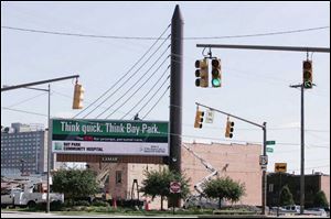A Lamar Advertising billboard at Erie Street and the Anthony Wayne Trail features a pylon with cables strung to appear to hold up the lighted signs. 
