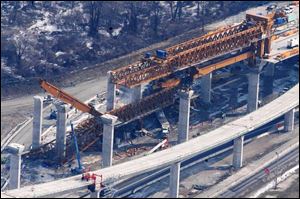 On Feb. 16, 2004, a huge gantry truss crane peeled away and crashed 60 feet to the ground. 