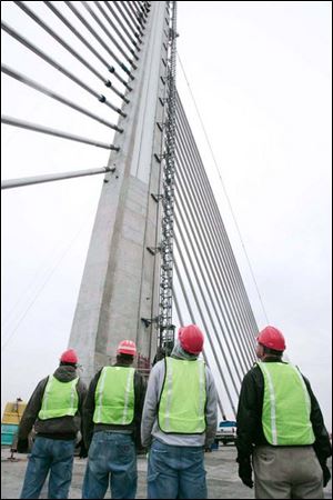 A group touring the Skyway in November gets a close look at the center pylon and the cables that support the bridge.