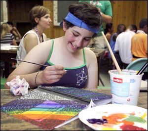 Sharon Taaffe, 15, of Kalamazoo, one of five Americans at the camp, paints in a journal. She'll be 16 tomorrow, and has battled leukemia.