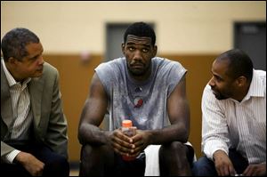 Greg Oden center, sits with his agents Bill Duffy, left, and Mike Conley Sr. during a news conference after Oden worked out at the Portland Trail Brazers' practice facility in Tualatin, Ore. Wednesday, June 20, 2007. The Trail Blazers have the No. 1 selection in the June 28th NBA basketball draft, and Oden, a forward from Ohio State, figures to be one of the top picks