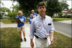 Marty Skeldon, a Democrat seeking the nomination as a candidate for city council from District 5, is out meeting and greeting his constituents on Grantley Avenue accompanied by, from left at rear, staffer Allison Dow, and volunteers Audrey Skeldon, his daughter-in-law, and George Young. Many other candidates have joined him in early campaigning.
