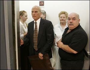 Former Bedford school board member Randy Krell, left, is on trial in Monroe County for his role in a fatal crash. 