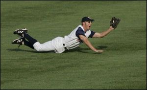 The Hens' Ryan Raburn dives to snag Chris Roberson's liner on opening play of the game.
