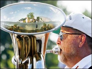 Dan Duvendack puts some oomph in the music provided by the Deurschmeister German Band.