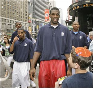 Greg Oden was a big attraction on the streets of New York yesterday, along with, clockwise from left, Ohio State teammate Michael Conley Jr., Kevin Durant and Al Horford.