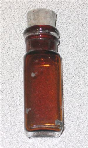 A vial that is believed to have held holy water was among religious objects included in the 1929 time capsule.
