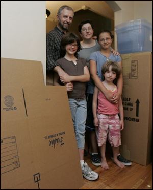 Rabbi Barry Leff, his wife, Lauri Donahue, and children Lizzy, 9, Katherine, 11, and Devorah, 6, are packing for their move to Israel.