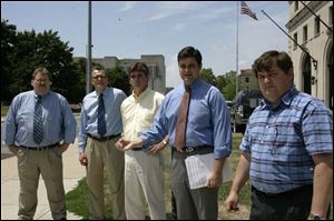 Council candidate Ed Cichy, left, Councilman Frank Szollosi, council candidate Marty Skeldon, and Councilmen Joe McNamara and Mike Craig want the mayor to balance the city s budget.