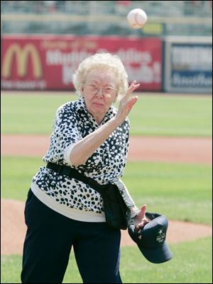 SPT hens01p 07/31/07 The Blade/Dave Zapotosky Location: Toledo, Ohio Caption: Ella Grace Scott, 89, a resident of West Park Place senior living community in Toledo had the honor of throwing out the ceremonial first pitch before the start of the Mud Hens game against Richmond Tuesday afternoon. She said she is a long time baseball fan who saw games at old Swayne Field. (There were a number of senior citizens in attendance Tuesday although there is apparently no official name for the promotion.) Summary: Toledo Mud Hens vs Richmond Braves baseball at Fifth Third Field. The Hens beat the Braves 8-4.