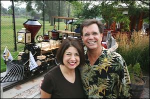 Ginny and Jim Slattery get ready to ride on the zoo s train during the clambake.
