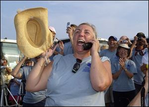 Linda Selvig, a school teacher from Idaho, reacts as Space Shuttle Endeavour lifts off Wednesday.
