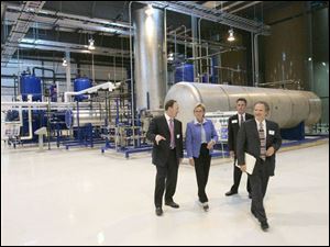 Gov. Jennifer Granholm tours the plant with owners Terry Nosan, left, Brad Schram, and Michael Horowitz. 