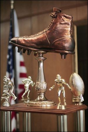 Hilton Murphy not only was the father of the Shoe Bowl, but he also designed its trophy, a size 14 bronze shoe.