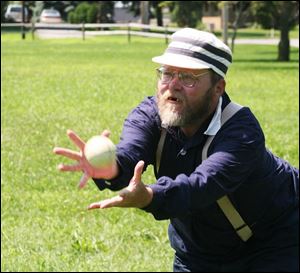 nbrs vintage15p       8/ 12/ 2007        The Blade/Herral Long   Craig Lammers   of BG makes a barehanded catch  playing catcher in 1800 baseball      Please get a Neighbors South wild art shot of the Infirmary  Inmates Vintage Base Ball Game sponsored by the historical center.  They're playing the Cincinnati Buckeyes.  Nate says