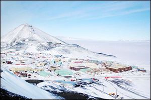 The McMurdo research station is situated along the coastline of Ross Island in Antartica.