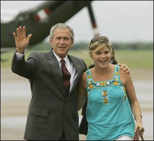 President Bush waves with his daughter, Jenna, as they walk to Air Force One in Waco, Texas, in this 2007 file photo. 