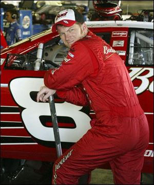 Dale Earnhardt Jr. checks out his car in the garage at MIS. Despite
being two spots out of the Chase, he s not too worried.