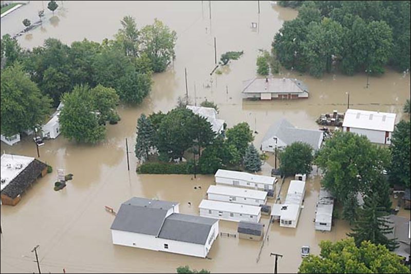 Rains flood roads, basements with showers likely through Saturday