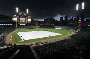 Storm clouds surround Comerica Park. The Tigers and Yankees waited four hours before starting at 11 last night.
