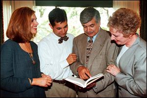 Daughter Natasha Hussain- Black, left, son Monie Hussain, S. Amjad Hussain, and his late wife, Dorothy, at a book signing in 1998. 