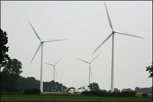 Four wind turbines operate at the Wood County Landfill in Bowling Green. Wind power is a source of renewable energy.