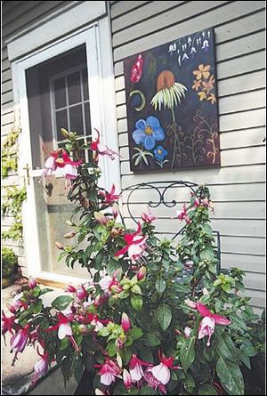 Award for overall best garden went to Christine and Don Helvey, who have blended art and plantings.