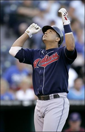 The Indians' Victor Martinez crosses home plate after homering in the second inning. Martinez had three hits last night.