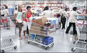 Mariah Cryderman, left, and her mom, Mary Cryderman,
leave with a full cart. 