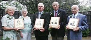From left, Jeanne Purkey Howison and Marilyn Purkey Neason, daughters of D.R. Purkey; Roger Snyder, Richard Tedrow, and Clifford Shelt display their awards at a ceremony at Sauder Village Founders Hall. There are 101 members in the hall of fame.