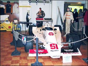 An Indy race car sporting Monroe shocks is among the items on display at the Monroe County Historical Museum.