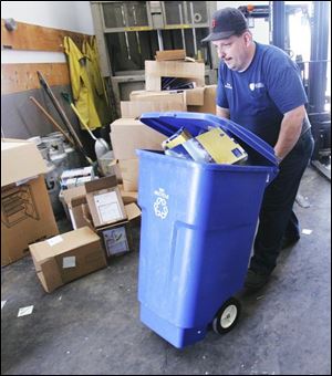 Ron Kubicki sorts recyclables at the University of Toledo,
where a number of energy-saving initiatives are under way.