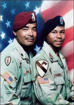 Maj. Reginald Truss began mentoring Sgt. Redus Thomas when the latter was a soft-spoken 8-year-old. Major Truss said he hardly recognizes his 'little brother' today. Sergeant Thomas has served two tours of duty in Iraq and helped prepare his 'big brother' when he was deployed to Afghanistan.