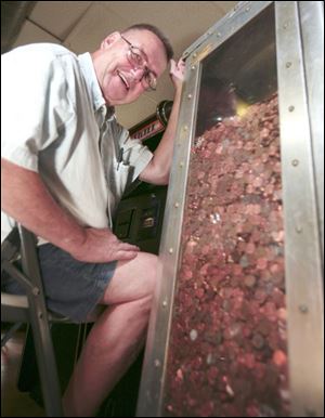 Ted Grandowicz figures he has about 400,000 pennies in a steel and bullet-proof glass bank he built.
