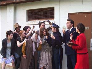 Rehearsing for the Croswell Opera House production of Urinetown are, in front from left: Jamie Buechele, Jessica Randall,
and Peggy Snead. In the back row, from left: Steve Dietrich, Sarah Nowak, Jesse Montie, Elizabeth Palmer, James Swendsen, Bruce Hardcastle, and Emily Gifford.