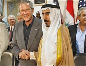 President Bush, left, shakes hands with Sheik Abdul-Sattar Abu Risha, an Iraqi tribal leader, during a meeting with tribal leaders at Al-Asad Airbase in Anbar province, Iraq, Monday, Sept. 3, 2007. The most prominent figure in a revolt of Sunni sheiks against al-Qaida in Iraq, Abu Risha was killed Thursday Sept. 13, 2007, in an explosion near his home in Anbar province, Iraqi police said.