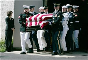 U.S. Rep. Paul Gillmor s coffin is carried by an honor guard after his funeral in Tiffin.