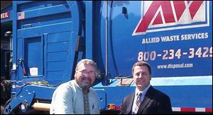 Maumee Mayor Tim Wagoner, left and Greg Salter of Allied Waste Services