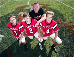 Arcadia coach Joe Kirkendall and seniors, from left, Seth Kirian, Mason True and Austin Riggs are off to a great start this year.